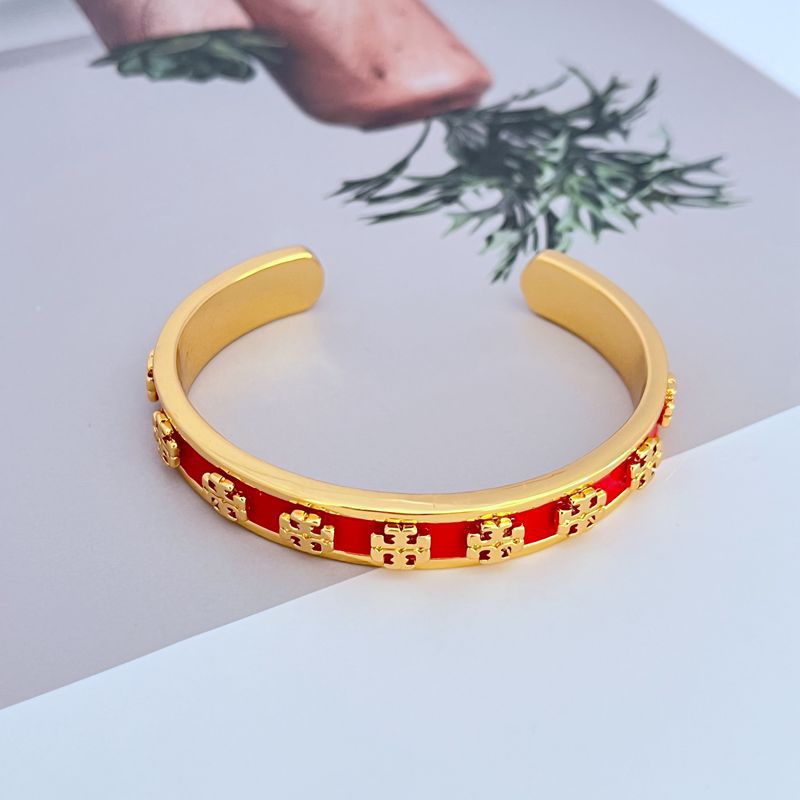 Bangle displayed standing upright against a plain white or light gray background, emphasizing the bold color segments.