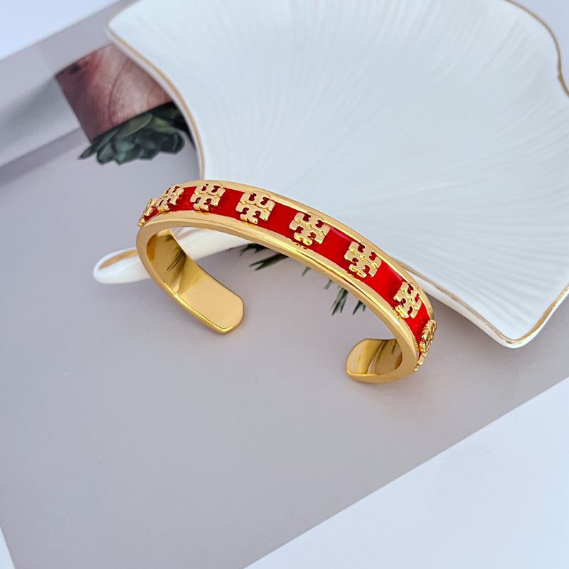 Close-up focusing on where the gold, black, and white panels meet, highlighting the clean edges and enamel finish.