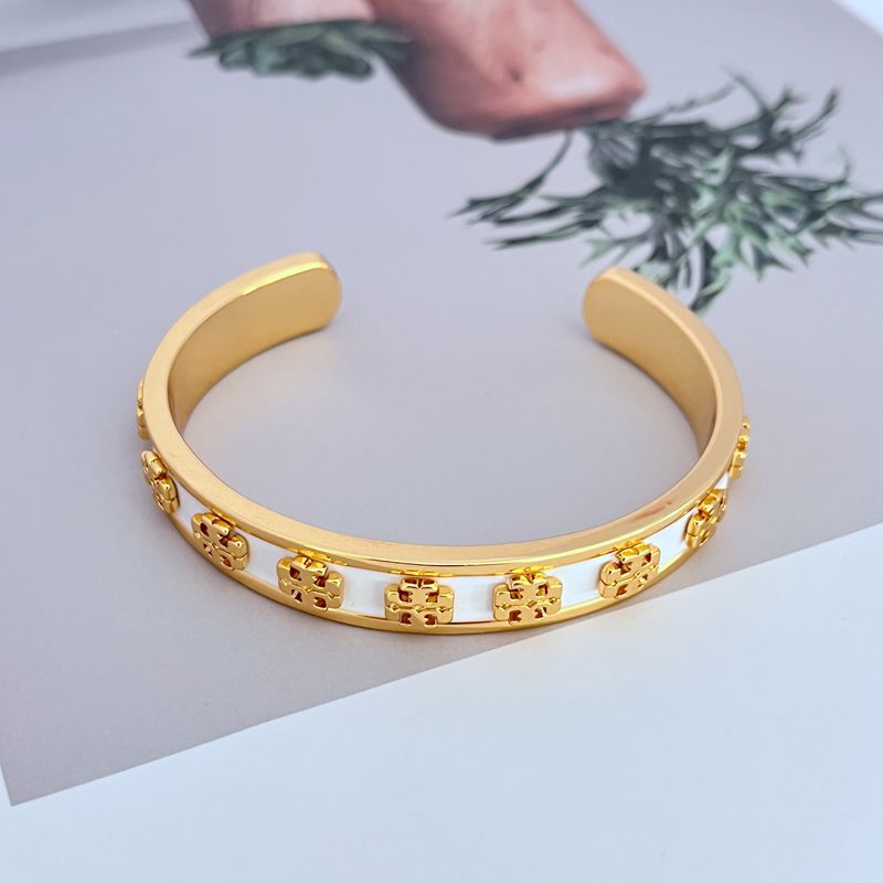 Bangle displayed standing upright against a plain white or light gray background, emphasizing the bold color segments.