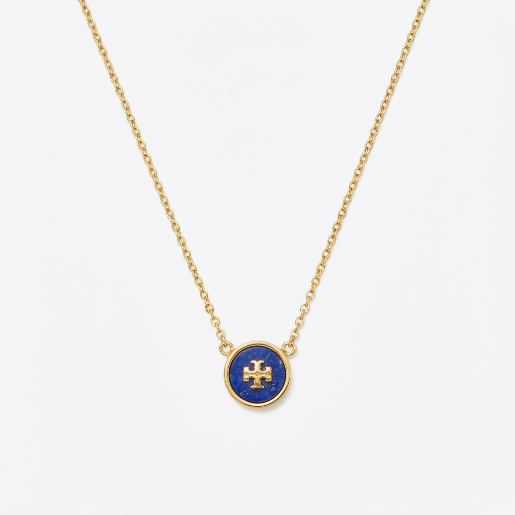 Necklace laid flat on a pure white background in a V-shape. Chain links evenly arranged and clearly visible. Soft, even lighting with minimal shadows, highlighting metal and stone clarity