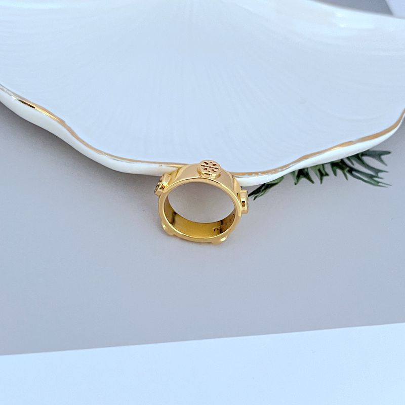 : The ring displayed alongside other Icon collection pieces or a Tory Burch fragrance, reinforcing a cohesive brand aesthetic.