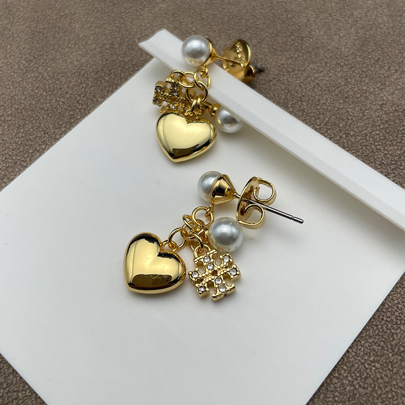 Both earrings displayed hanging naturally against a light background, showing all charms clearly arranged in sequence.