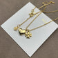 Both earrings displayed hanging naturally against a light background, showing all charms clearly arranged in sequence.