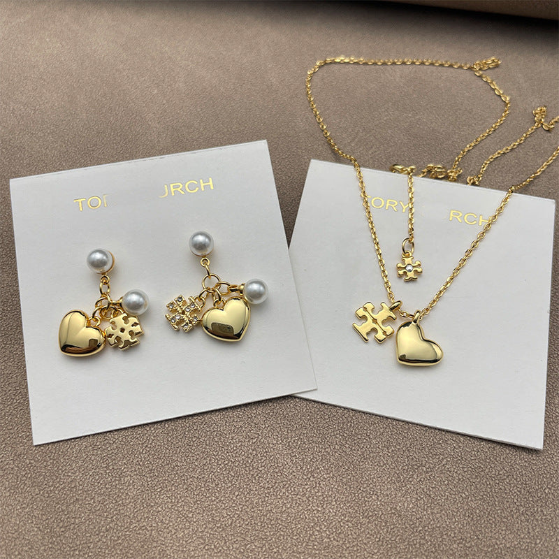 Both earrings displayed hanging naturally against a light background, showing all charms clearly arranged in sequence.