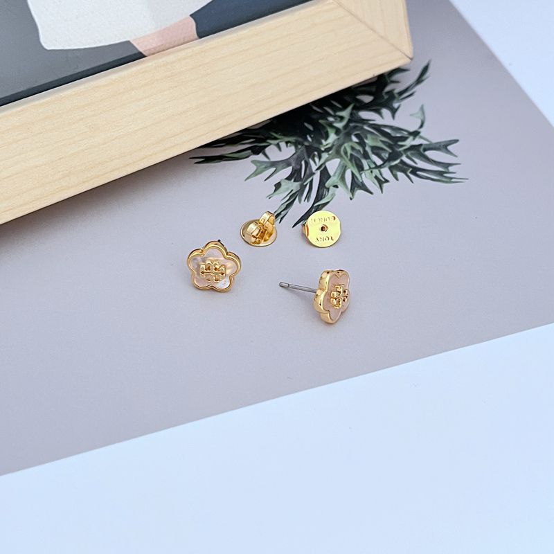  Extreme close-up focusing on the texture of the flower petals and the smooth, glossy finish of the enamel center, highlighting the craftsmanship.