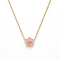 A gold-plated flower-shaped pendant necklace with a light pink enamel center and a gold cross in the middle, shown on a clean white background.