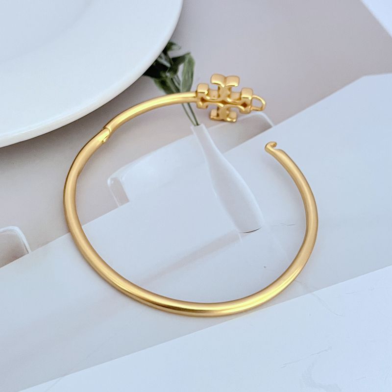 Close-up focused on a section of the bangle, showcasing the depth and precision of the chevron engraving/embossing.