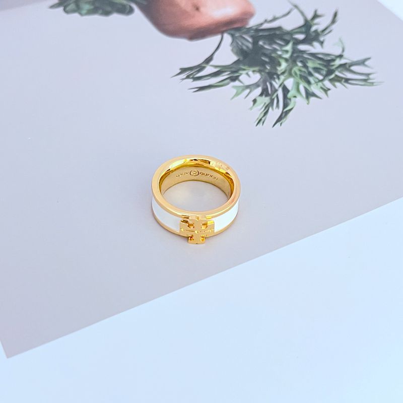  Clean, angled shot of the ring on a plain background or a ring stand, clearly displaying the oversized Double T logo face.