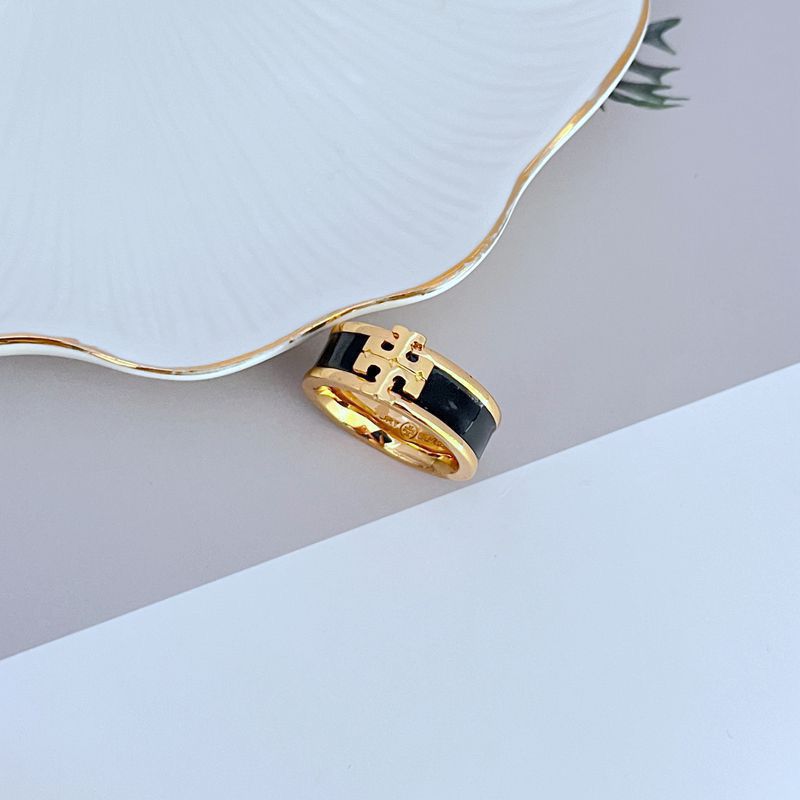  Clean, angled shot of the ring on a plain background or a ring stand, clearly displaying the oversized Double T logo face.