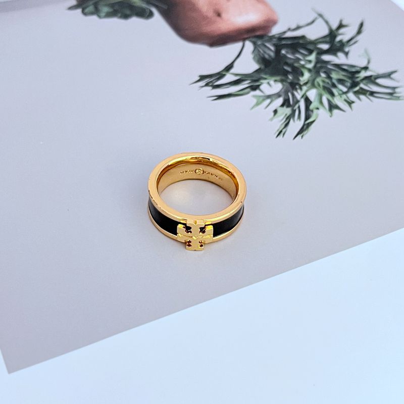 A confident individual with a modern, minimalist outfit, using the ring as the standout accessory. The focus is on the hand and the ring's impact.