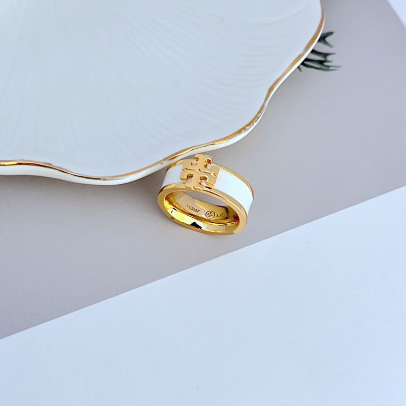  Clean, angled shot of the ring on a plain background or a ring stand, clearly displaying the oversized Double T logo face.