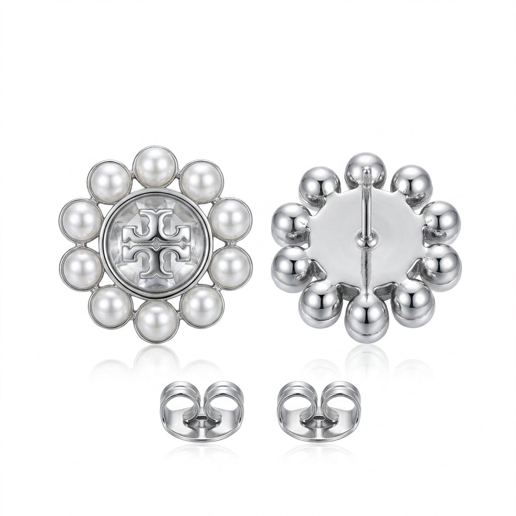 Pair of earrings with pearl-like beads and a logo on a white background