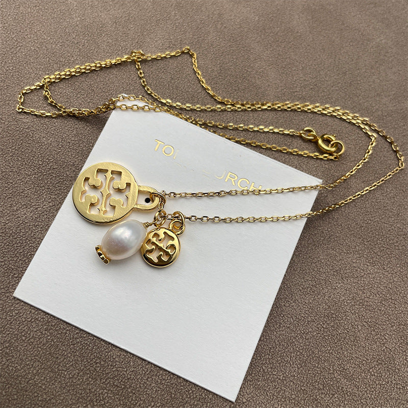 Split close-up focusing on the chevron’s engraved texture and the pearl’s smooth luster side by side.