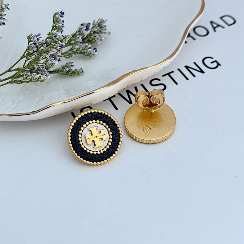  Extreme macro shot focused on the leather inlay, showcasing its grain, color depth, and the precise setting within the metal frame.

