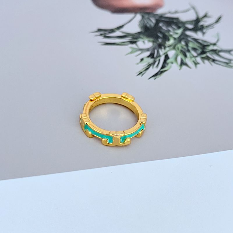  Macro shot focused on the detail of the serif font and the smooth, glossy surface of the enamel.