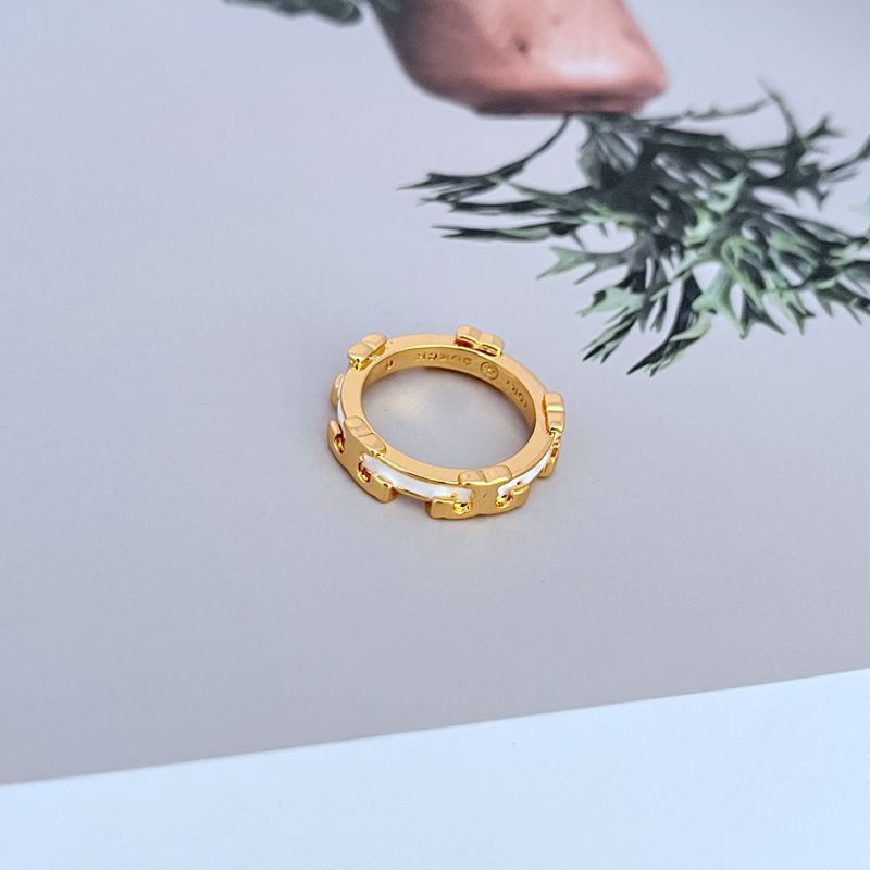  Macro shot focused on the detail of the serif font and the smooth, glossy surface of the enamel.