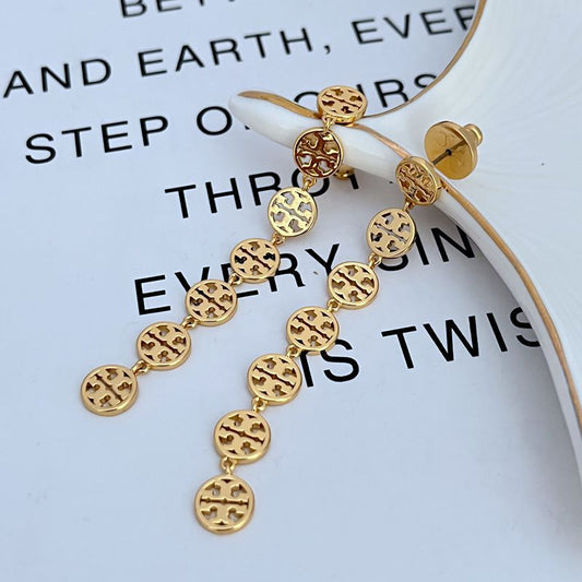Both earrings displayed hanging at full length against a plain background, clearly showing the chain and logo charm.