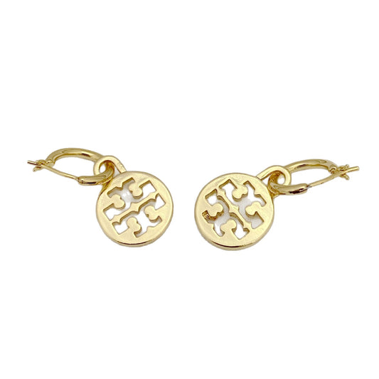 Gold earrings with a cut-out design on a white background