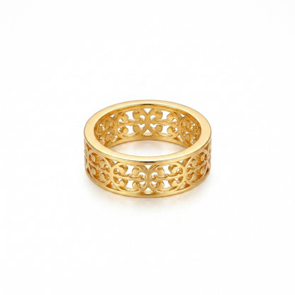 A gold filigree band ring with an intricate openwork pattern, shown on a clean white background.