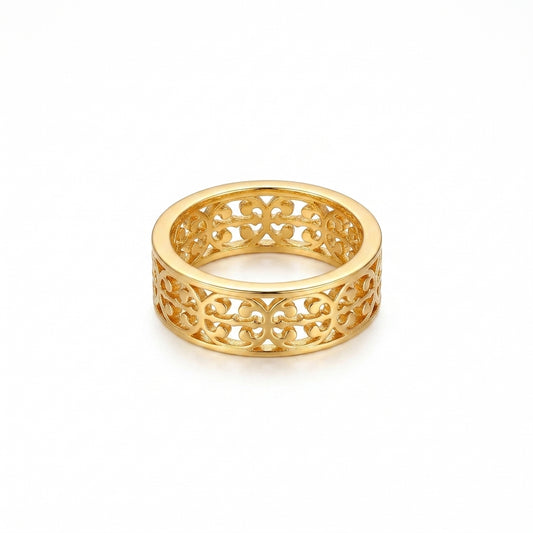 A gold filigree band ring with an intricate openwork pattern, shown on a clean white background.