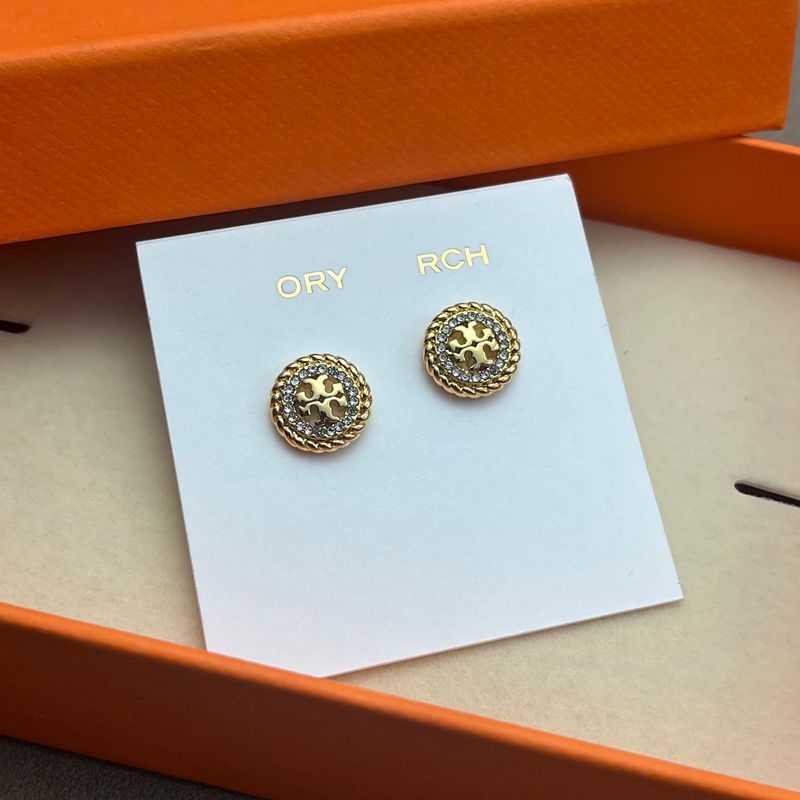 Both earrings displayed face-up on a dark, smooth surface (black marble), highlighting the contrast between the textured rope border and crystal sparkle.