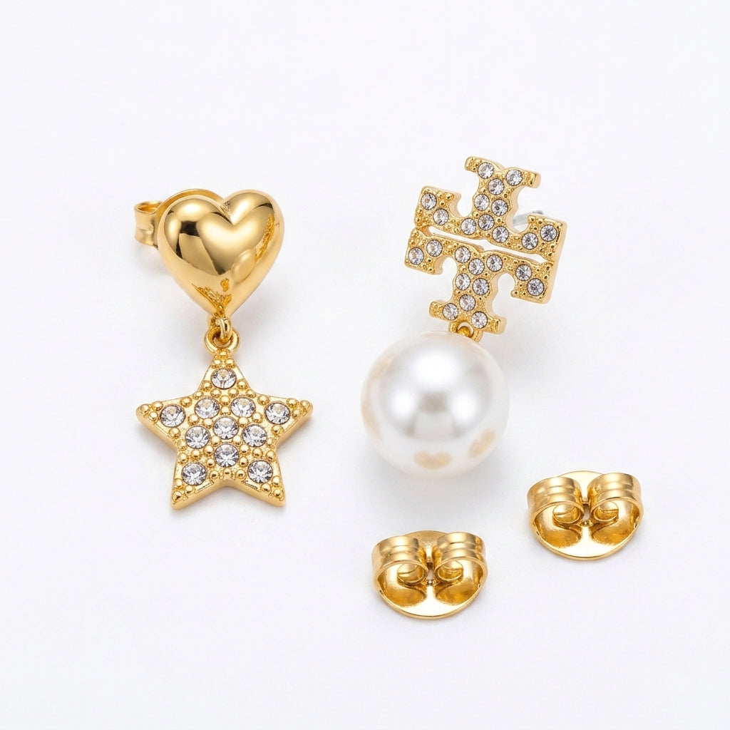Gold heart, star, and crown earrings with a pearl on a white background