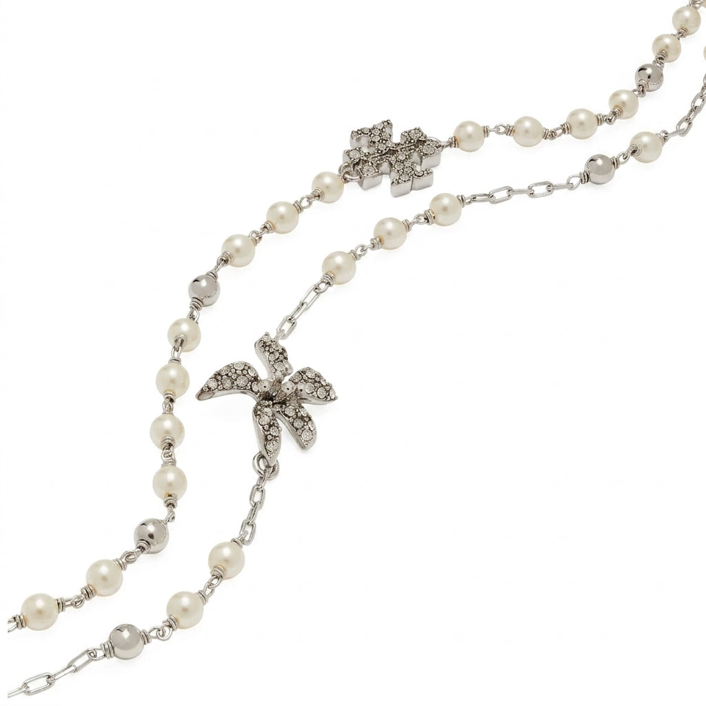 A pearl and silver chain necklace featuring two silver flower charms embellished with clear crystals, displayed on a clean white background.