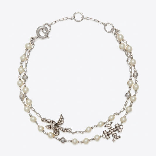 A silver-tone double-strand necklace featuring white faux pearls, a silver butterfly embellished with clear rhinestones, and a silver cross pendant, displayed on a light gray background.