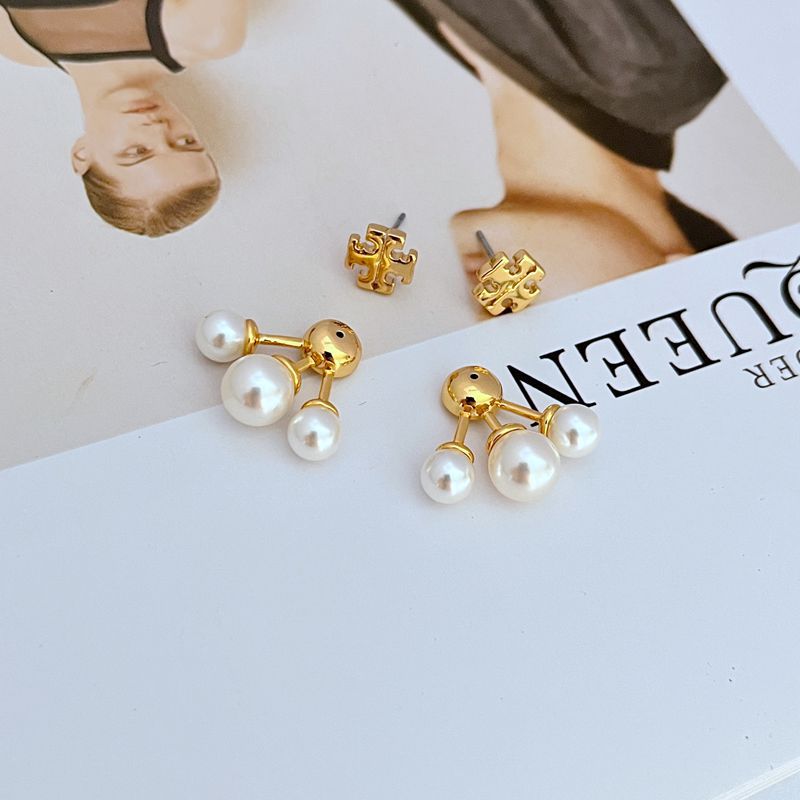 Close-up focused on the smooth freshwater pearl and its setting.