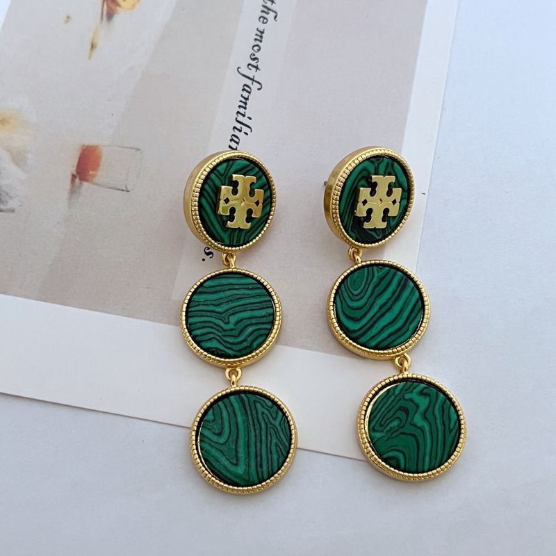 Green marbled earrings with gold accents on a light background