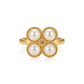 A gold ring featuring four round white pearls arranged in a flower-like cluster, set against a clean white background.