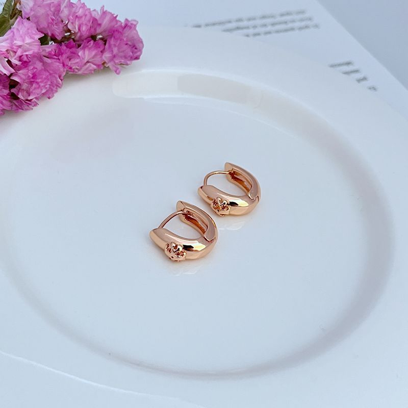 Both hoops displayed on a dark, non-reflective background to maximize the brilliance of the crystal section against the metal.