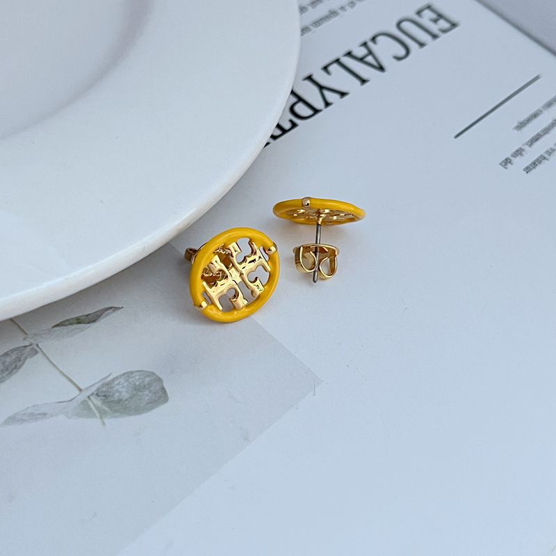 Macro shot focused on the seam where the enamel and metal meet, showcasing the precision of the color division and the smooth, glossy finish of both materials.

