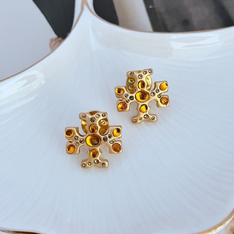 Extreme macro shot focused on the pave setting of the cubic zirconia, highlighting the stone clarity and the elegant script font.