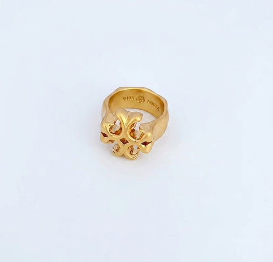 A gold ring with a sculptural, openwork floral or knot-like design on the front, photographed on a clean white background. The inside of the band is stamped with 'VERDI FERRAGNA'.
