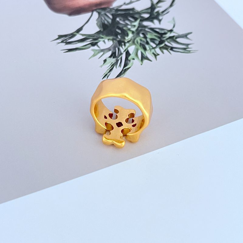 Clean, well-lit shot of the ring on a neutral background or velvet ring pad, highlighting the warm Tory Gold finish and the Double T logo.