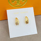 High-definition shot of the pair of earrings laid flat on pure white background, arranged symmetrically.