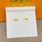 High-definition shot of the pair of earrings laid flat on pure white background, arranged symmetrically.