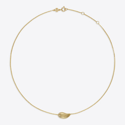 A delicate gold chain necklace with a small, polished gold leaf-shaped pendant, displayed on a clean, light gray background.