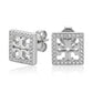 Silver earrings with a geometric design on a white background