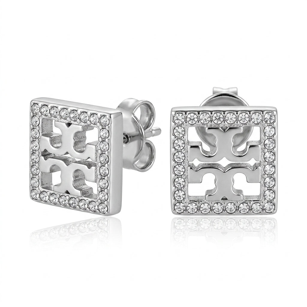 Silver earrings with a geometric design on a white background