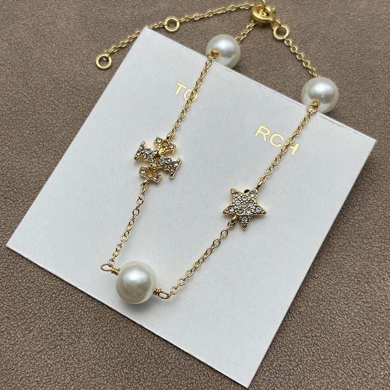 Both earrings displayed against a dark, navy blue or black velvet background to make the gold tone and crystal sparkle stand out dramatically.