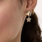 Earrings worn by a model with hair swept to one side, showing the elegant drop length and how they catch the light when moving.