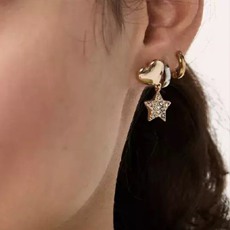 Earrings worn by a model with hair swept to one side, showing the elegant drop length and how they catch the light when moving.