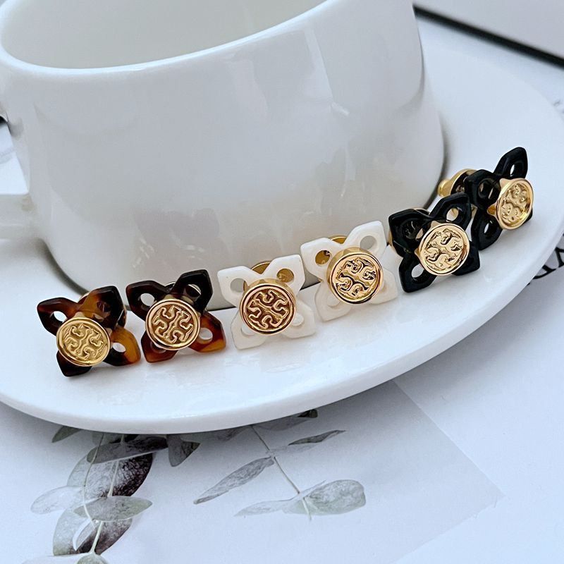  The jewelry arranged on a surface with other classic elements like a leather-bound book, a silk scarf, or a pair of eyeglasses, evoking an intelligent, timeless, and sophisticated aesthetic.