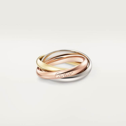 Trinity Tricolor Interlocking Rings Cartier ring with three interlocking bands on a light background