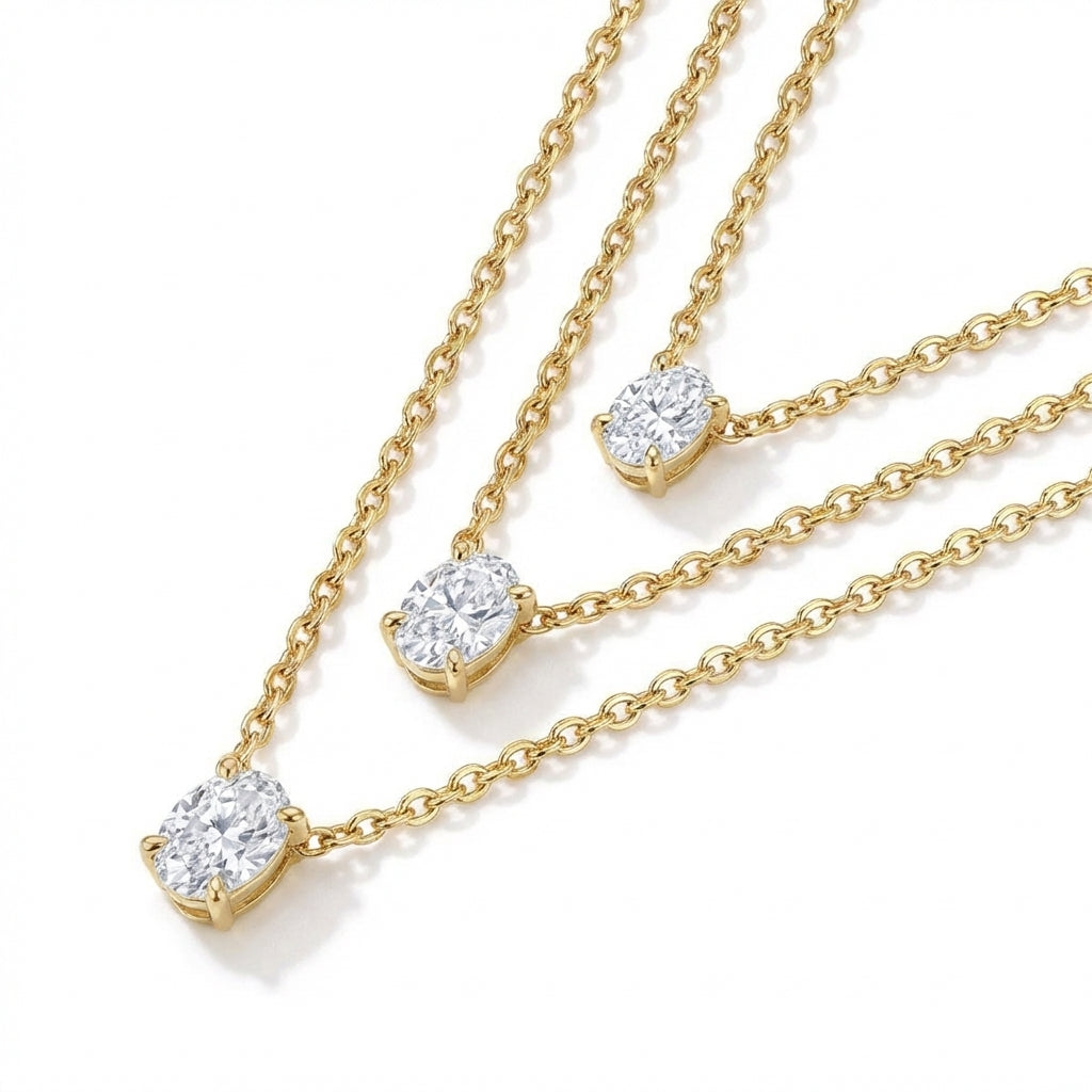 Macro, layered necklaces in 45° diagonal parallel layout, even spacing, mirror-polished gold, bright clean lighting, sharp stone brilliance, white textured background, soft shadow, ultra-detailed.