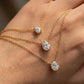 Macro, necklace draped across female hand, natural curve, warm soft light, mirror metal shine, sharp sparkle, blurred skin background, detailed texture, intimate luxury feel.