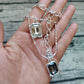 Necklace worn at full length. Alt: “Cascading Light: UNO de 50 Crystal Necklace.”