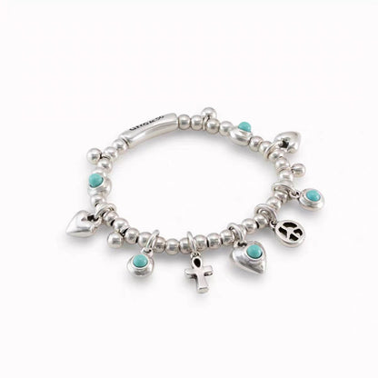 A sterling silver charm bracelet with small round beads, turquoise stone accents, and multiple dangling charms including hearts, an anchor, a peace sign, and a small cross, shown on a plain white background.